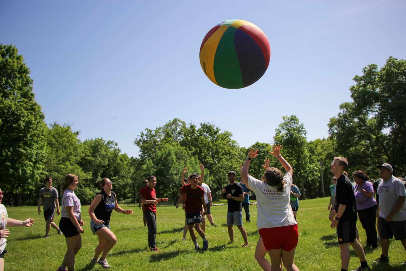 A group of kids playing a game of Earth Ball at summer camp in Iowa.