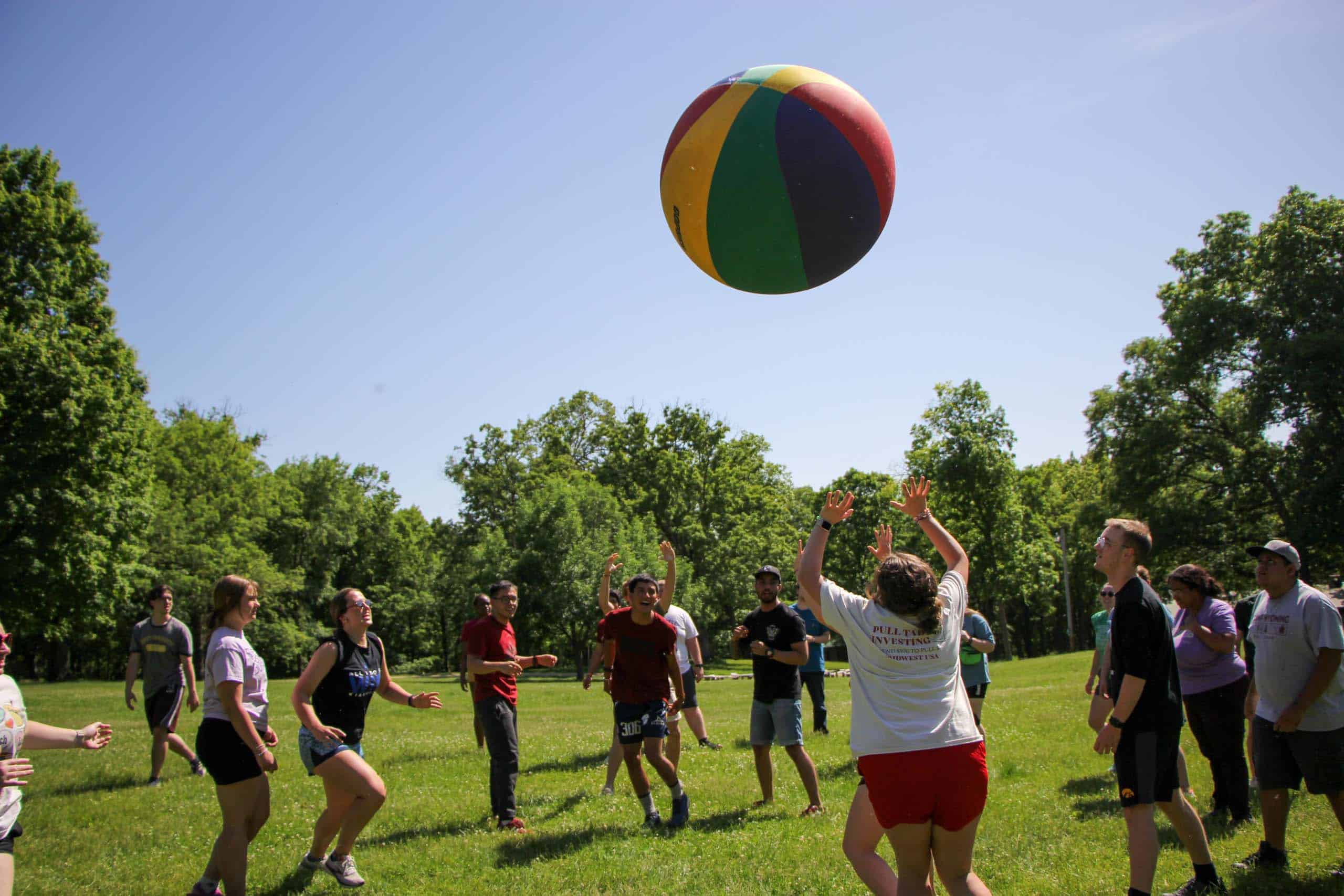 A group of kids playing a game of Earth Ball at summer camp in Iowa.