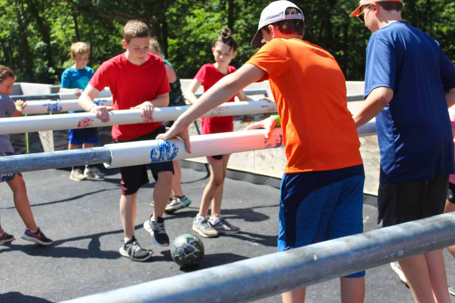 Kids at an Iowa summer camp enjoy a fun game of Human Foosball.