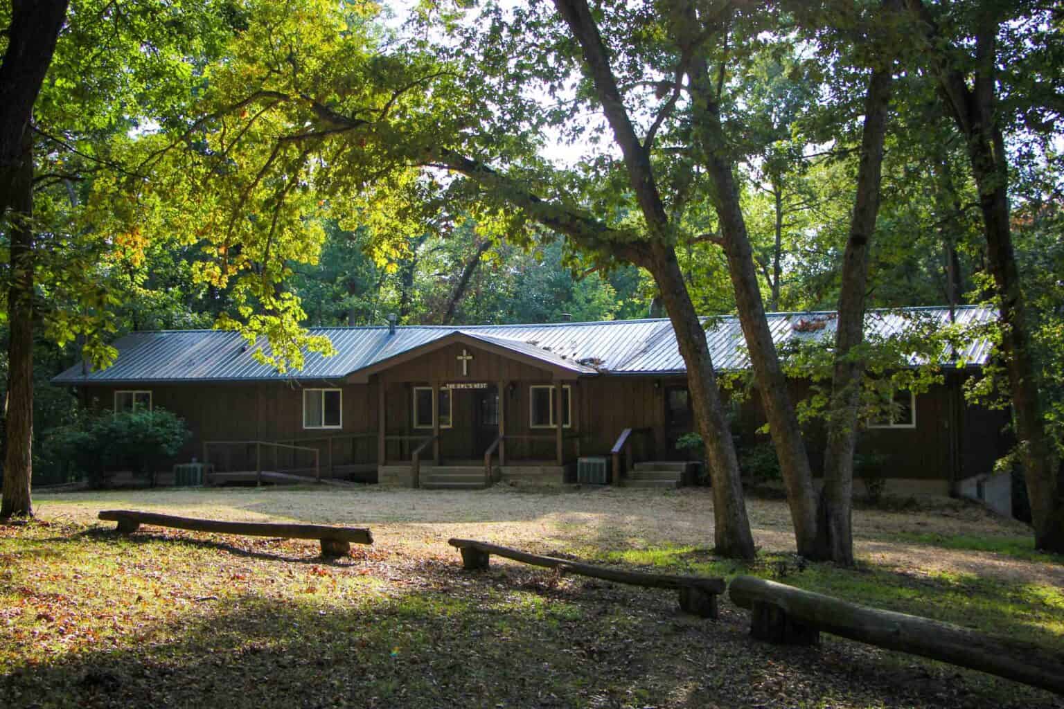 A small summer camp cabin in the woods of Iowa.