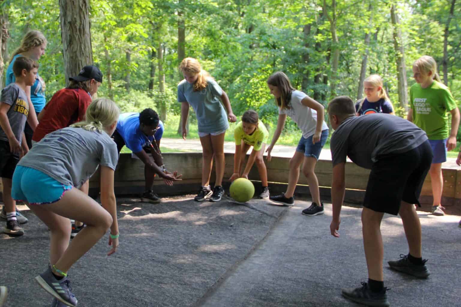 A group of kids playing a game of GaGa at summer camp in Iowa.